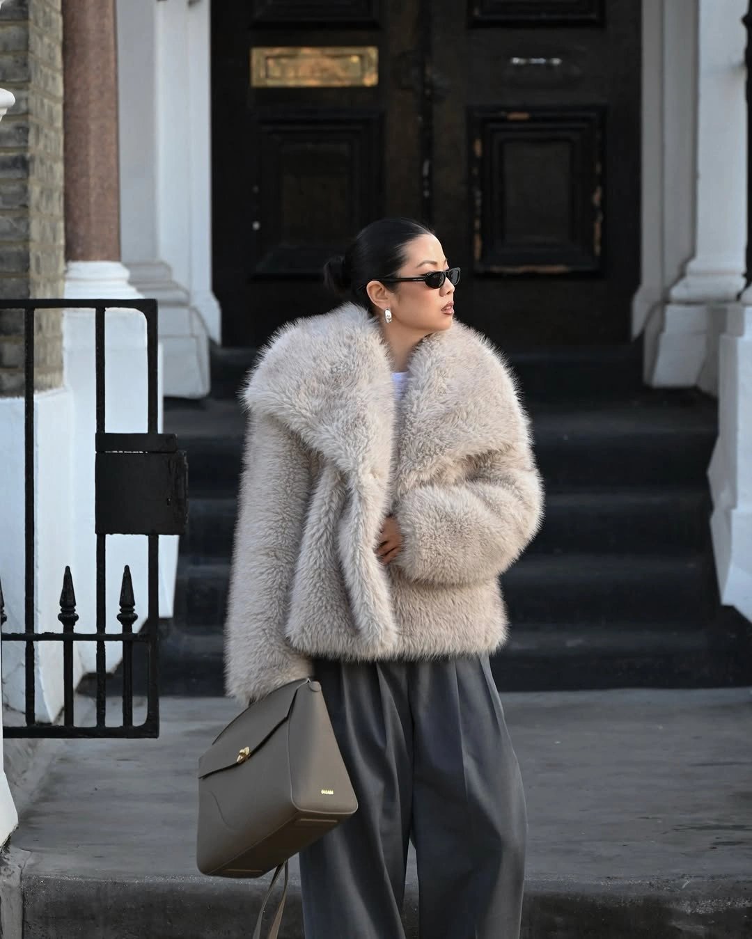 Pale gray textured jacket with charcoal wide trousers and handbag