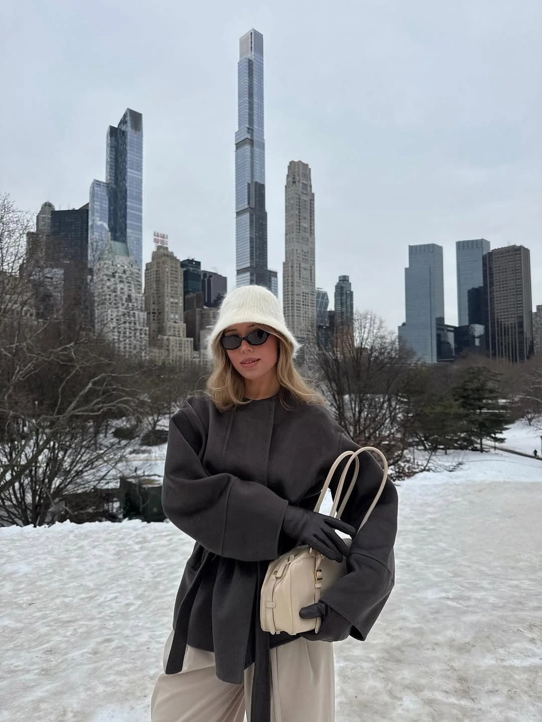 Oversized charcoal top with pale wide trousers and white beanie