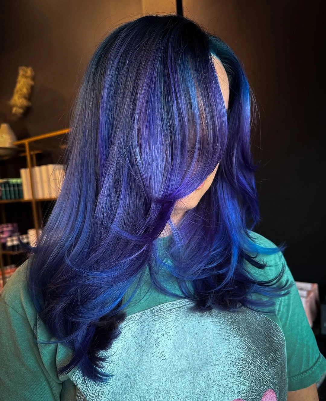 Layered hair with navy roots and blue violet lengths