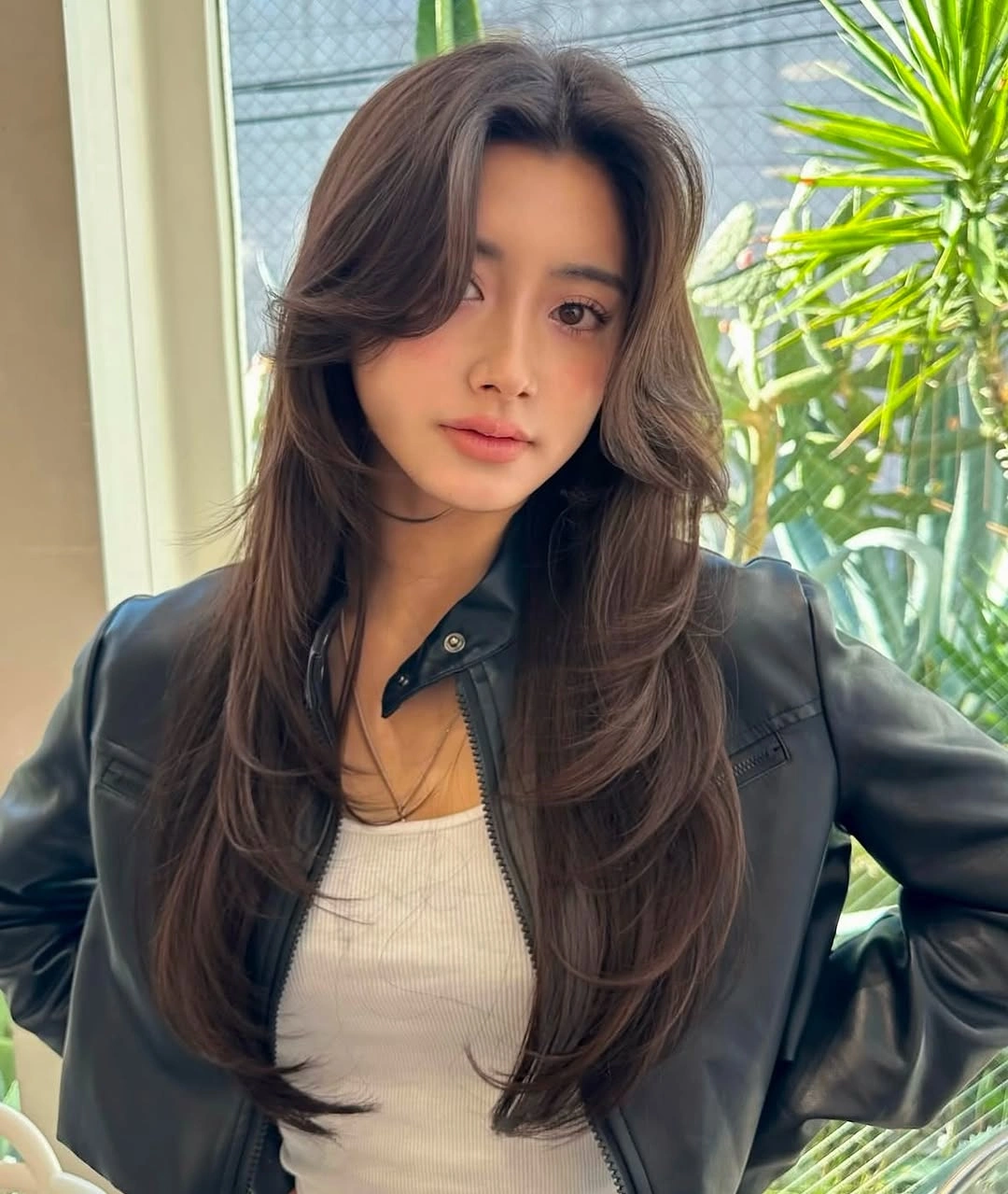 Long dark brunette hair with lifted face framing layers
