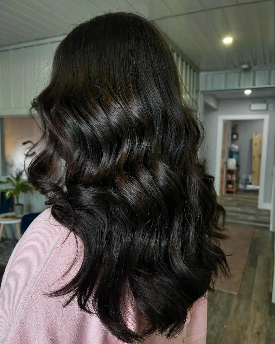 Long black brown hair with broad back view waves