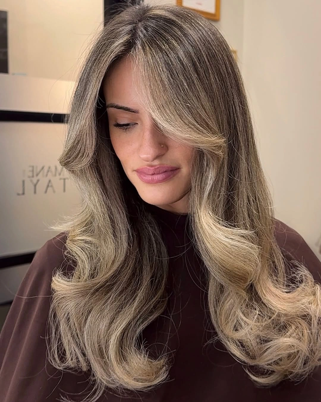 Long brunette waves with beige blonde face framing ribbons