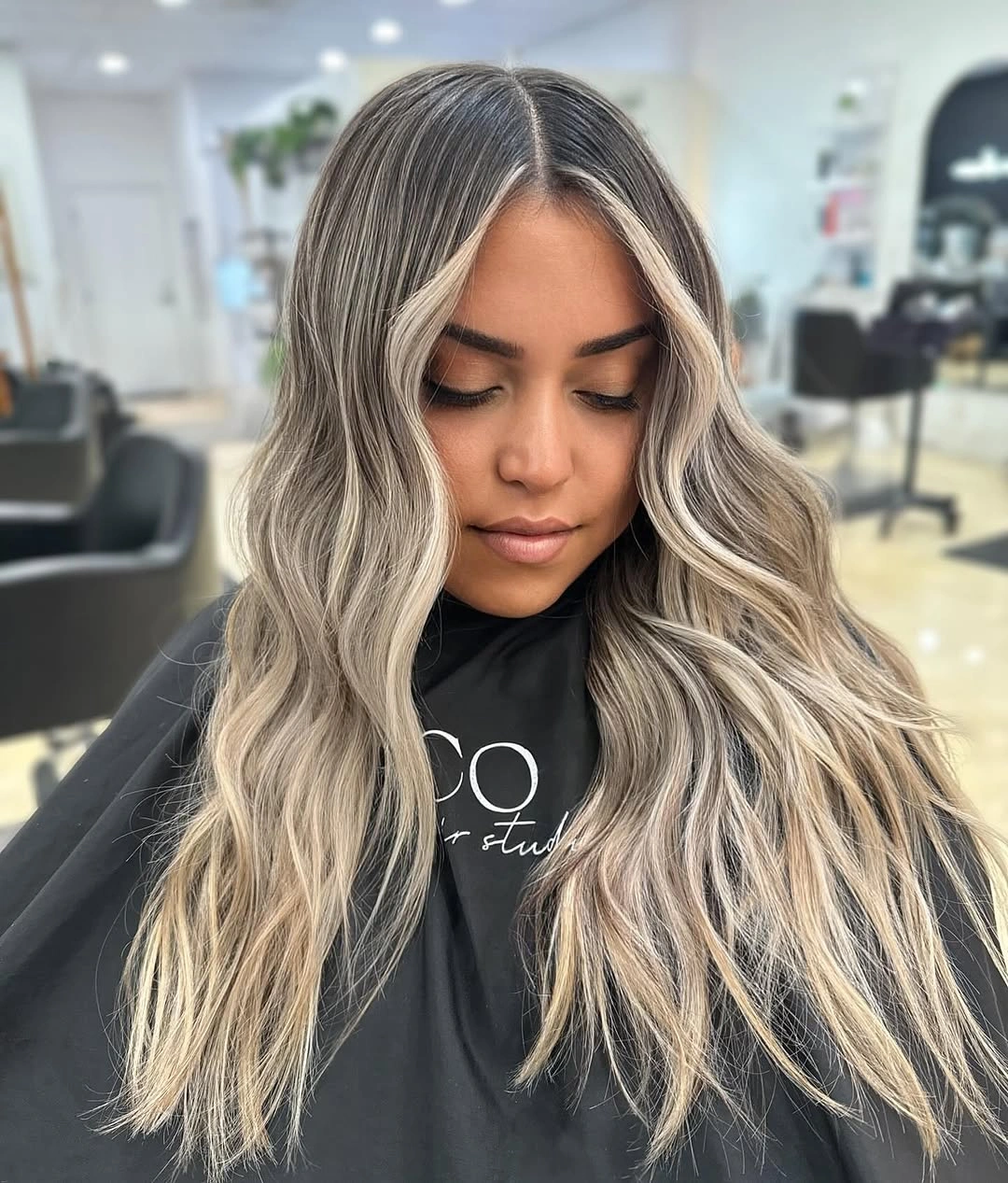Long ash brunette waves with pale face framing panels
