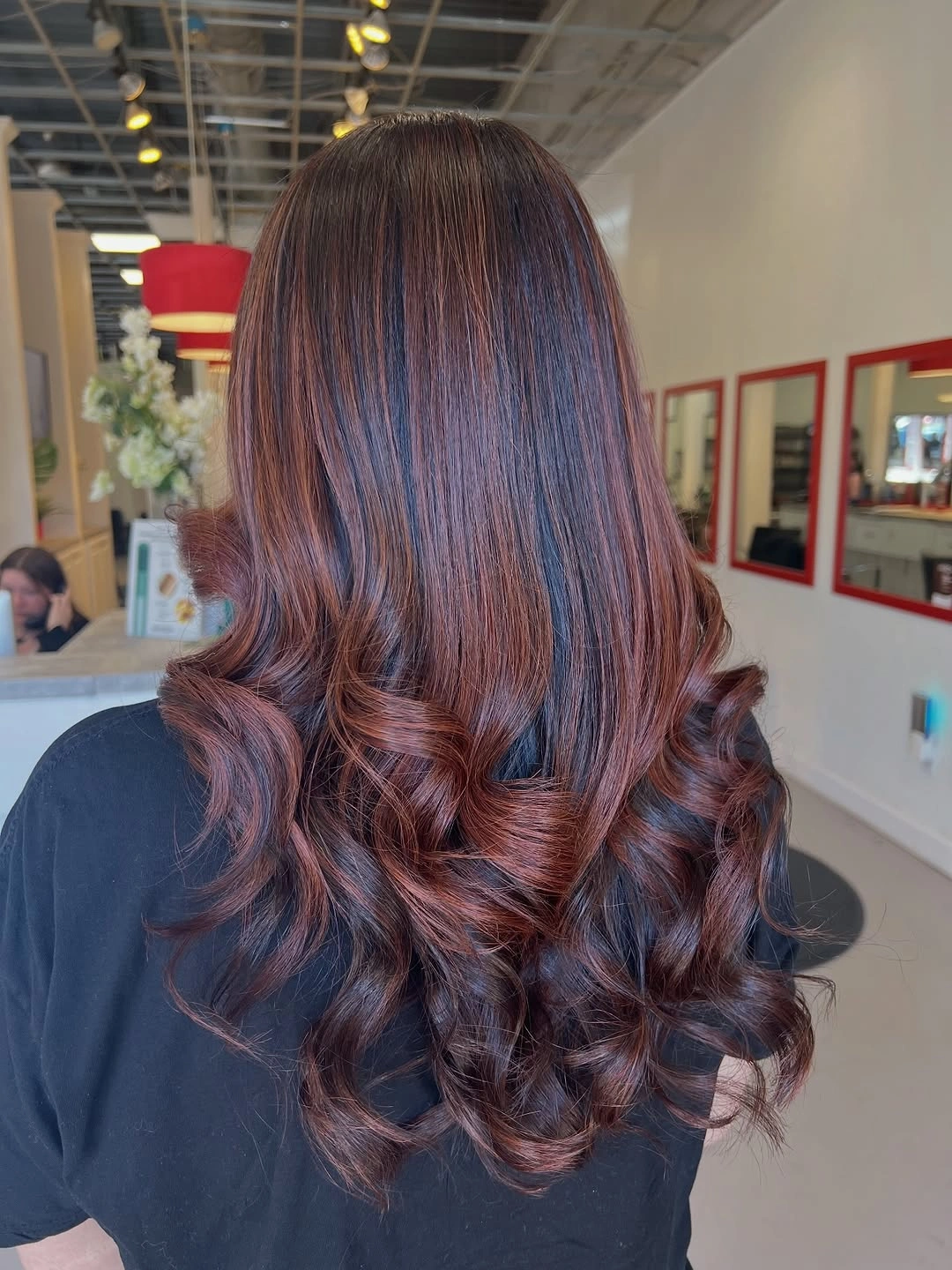 Back view brunette hair with plum copper curled ends