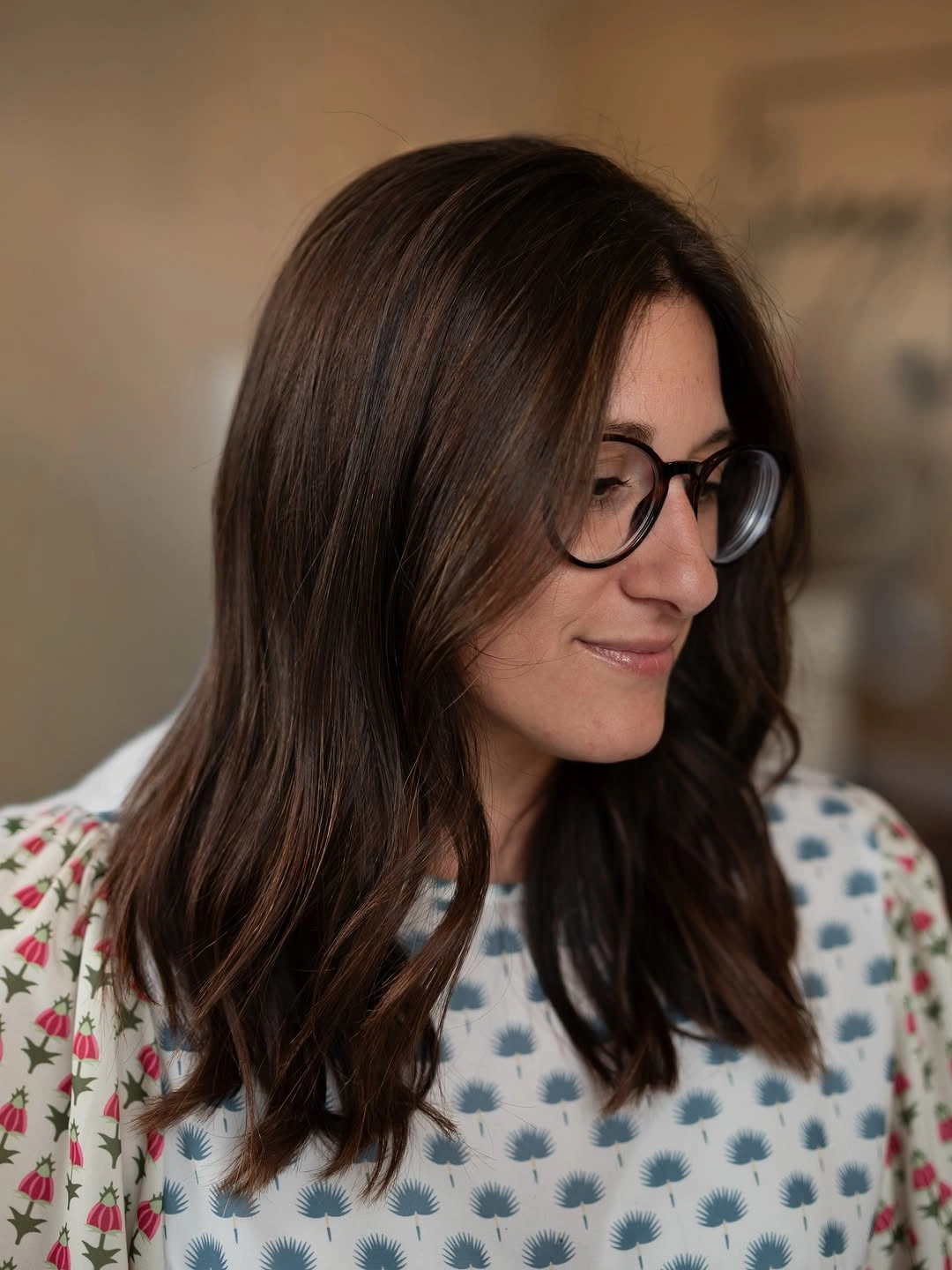 Medium long chocolate brunette hair with subtle warm strands