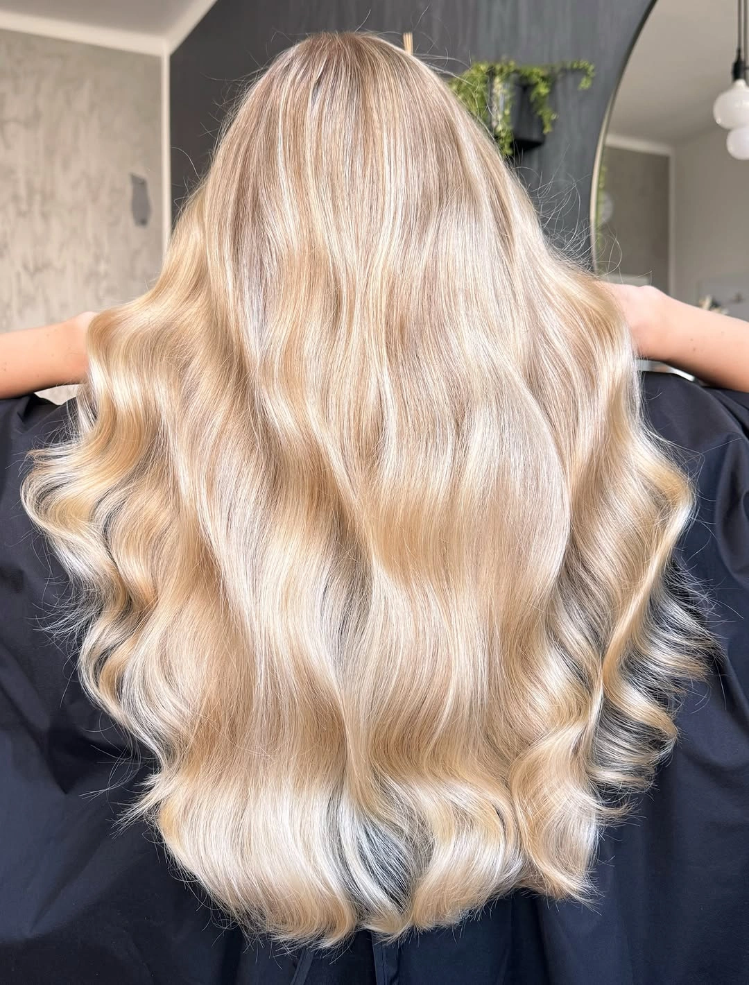Back view of long champagne blonde waves with pale ribbons