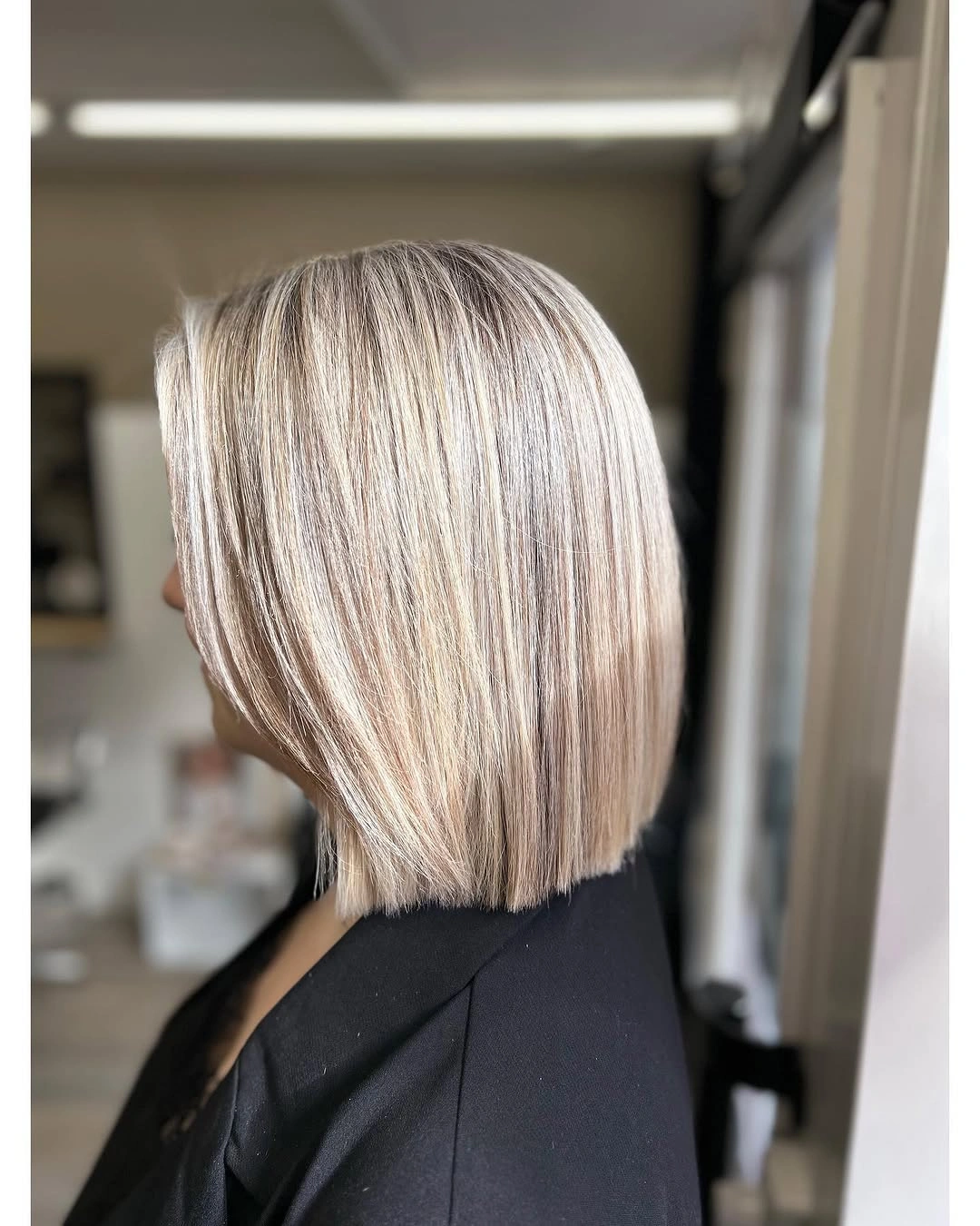 Side view of ash blonde bob with darker vertical pieces