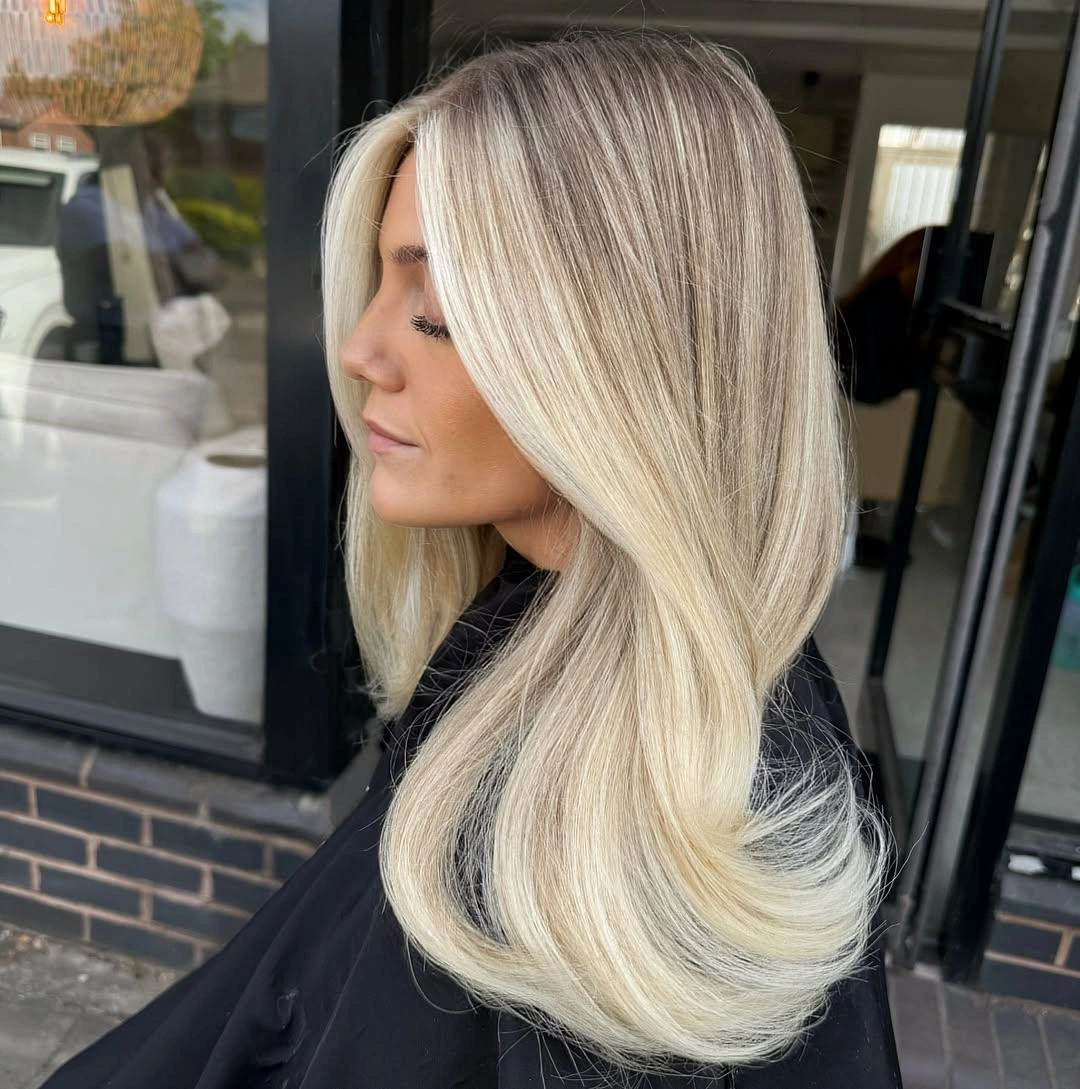 Side view of long blonde hair with darker interior depth