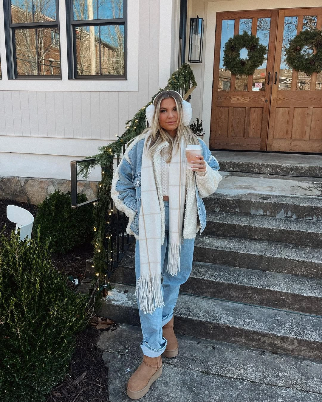 Pale denim jacket cream scarf cuffed jeans and tan boots
