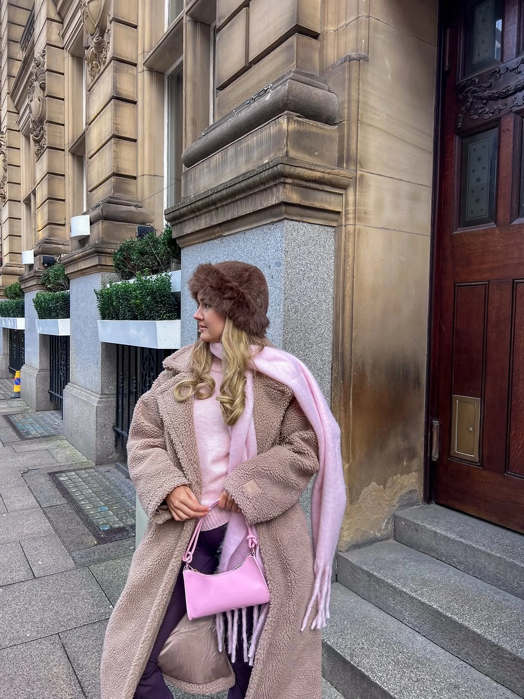 Taupe teddy coat pink scarf sweater bag and tall boots