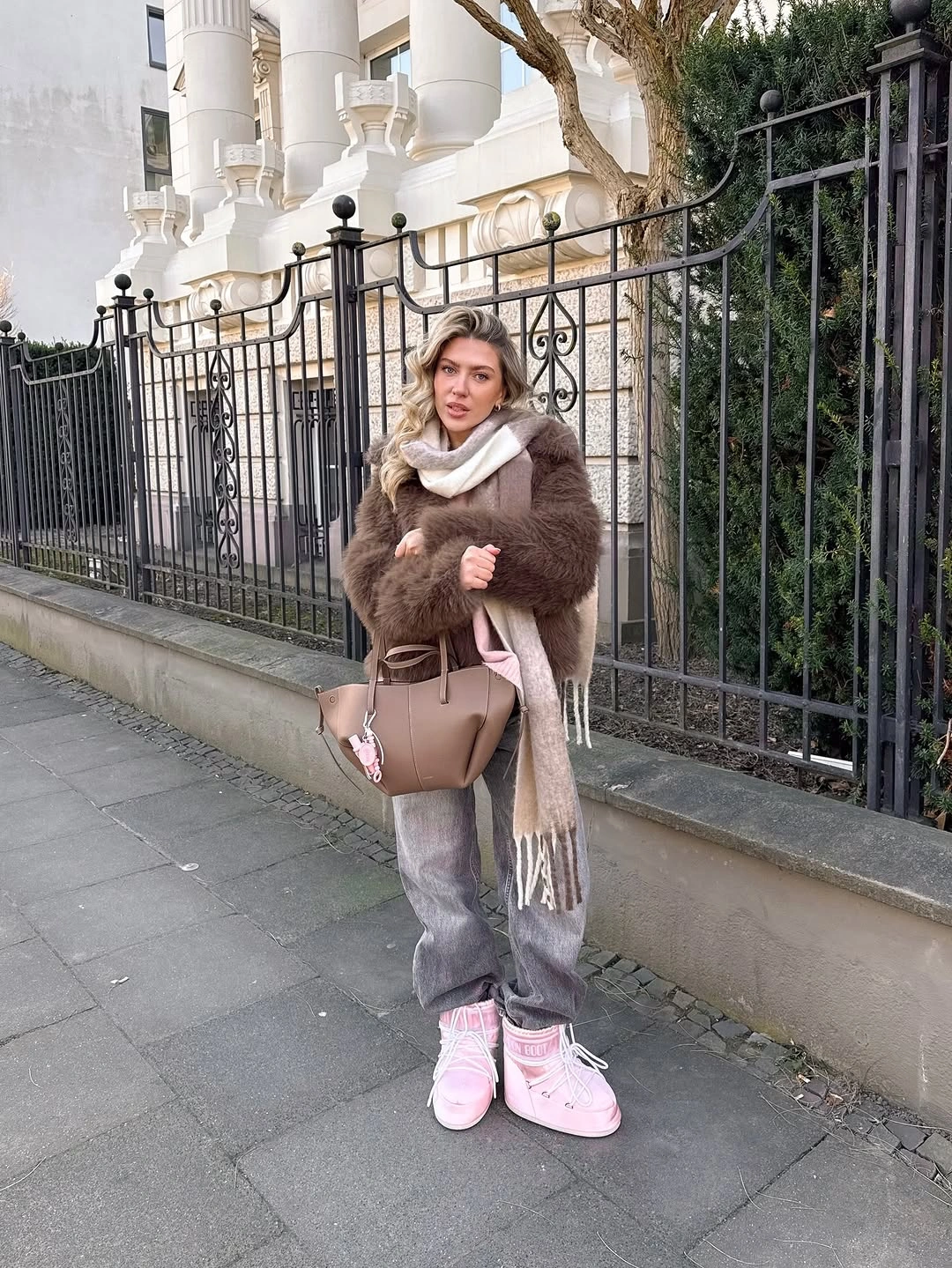 Brown fuzzy jacket long scarf gray wide jeans and pink boots