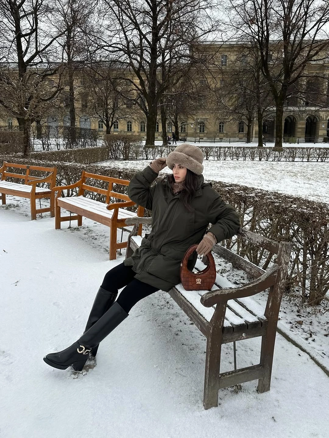 Olive parka taupe hat gloves black leggings and tall boots