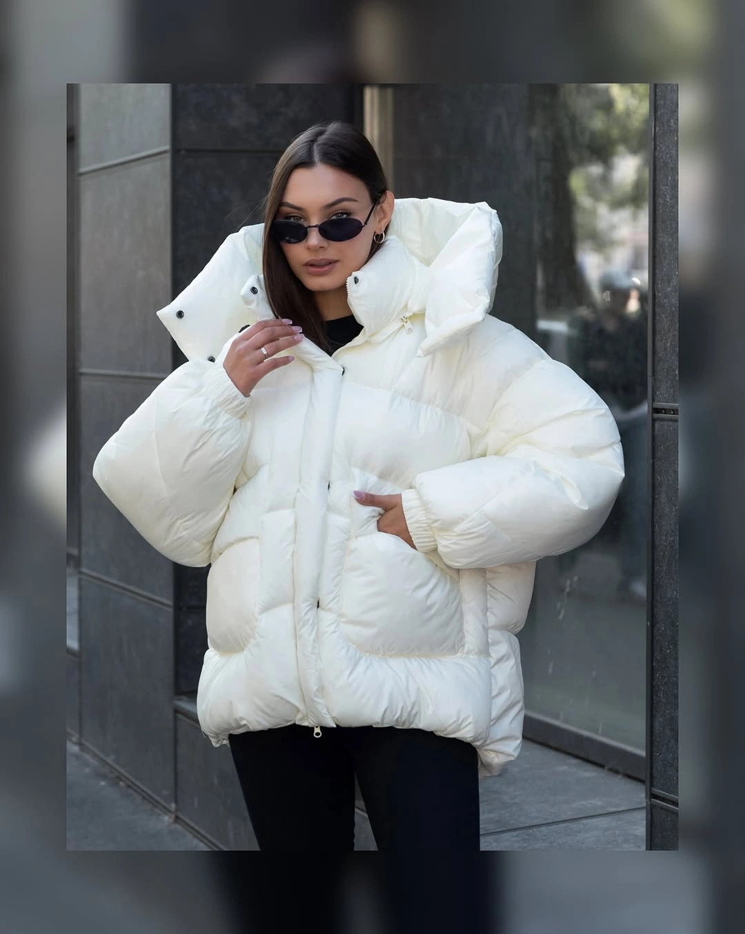 Plum-brown fur-like jacket with maroon striped track pants and sneakers