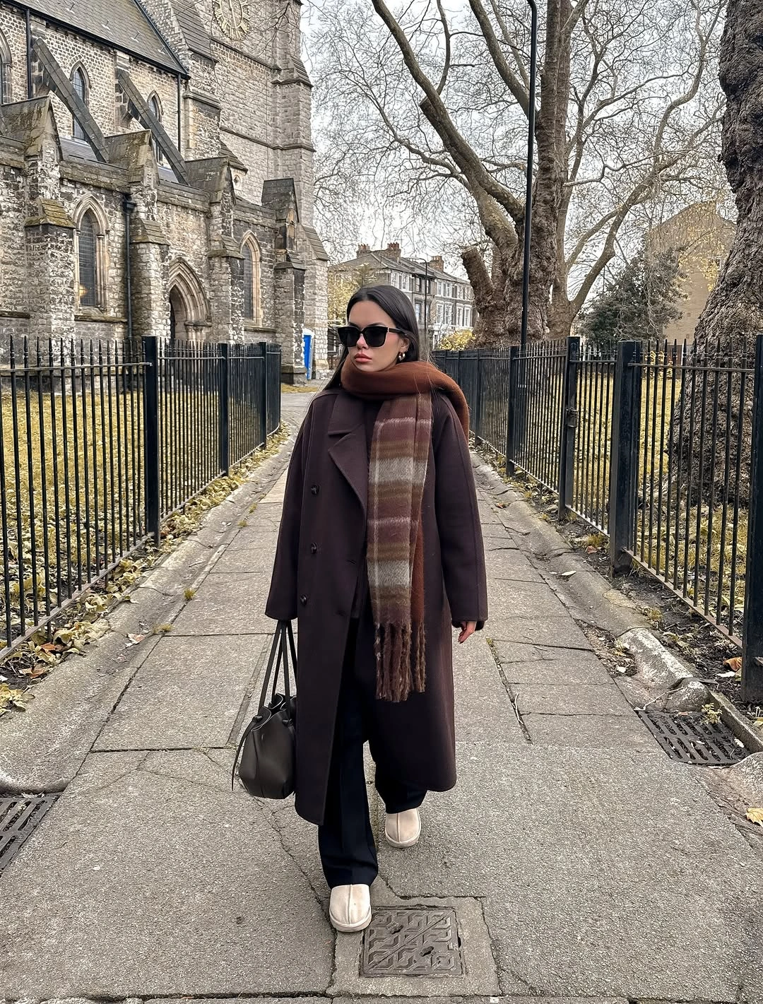 Brown fuzzy sweater with wide trousers cap and tan shoes