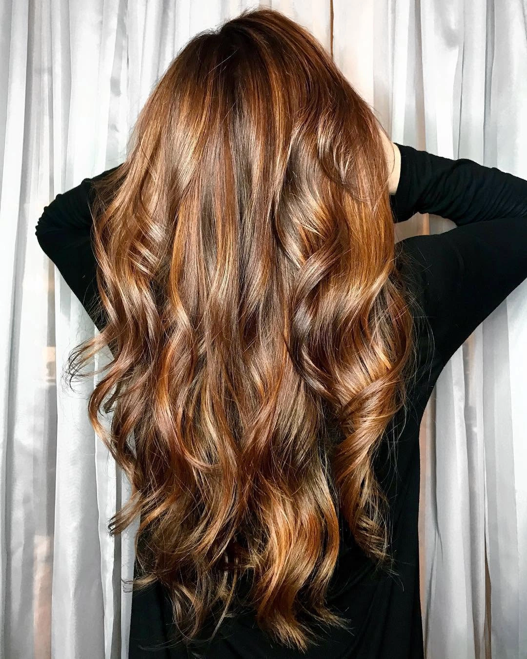 Long warm brown waves with copper-gold ribbons