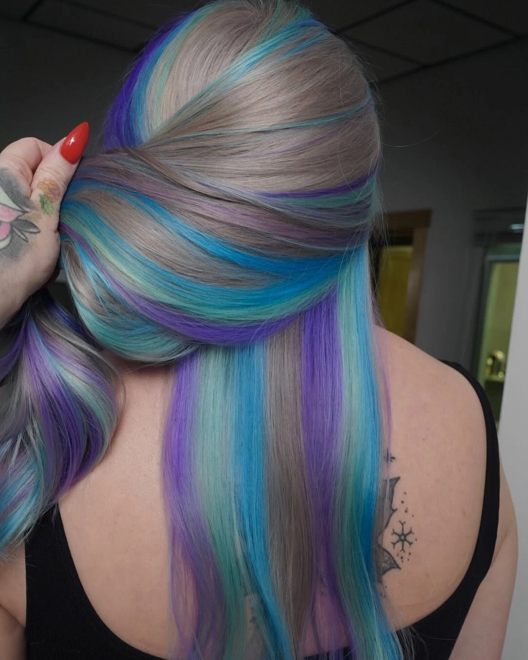 Pale silvery hair with turquoise and violet sections