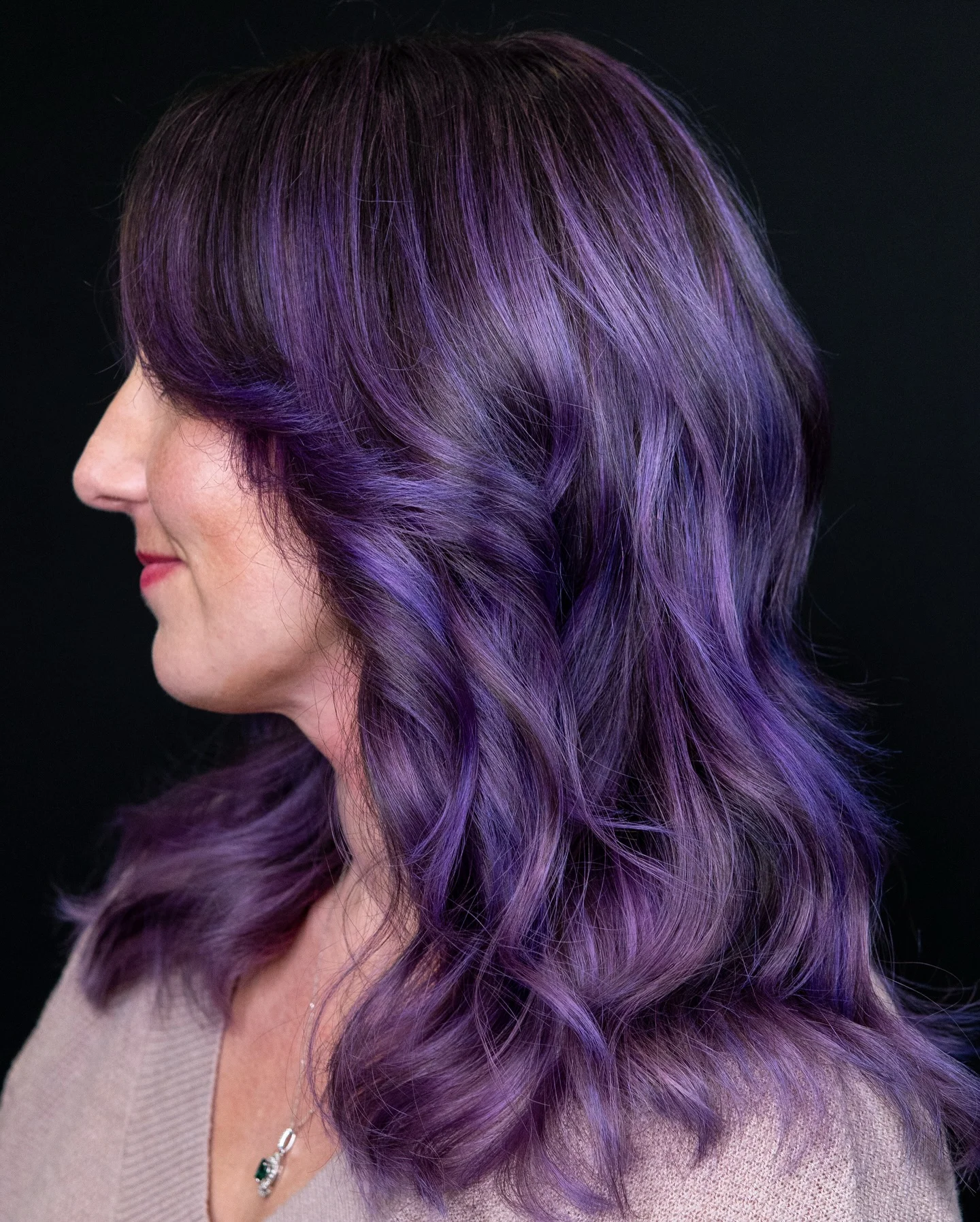 Medium violet-purple wavy hair with darker shadowed sections