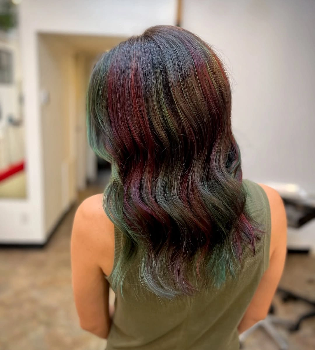 Dark brown waves with muted red and green-toned ribbons