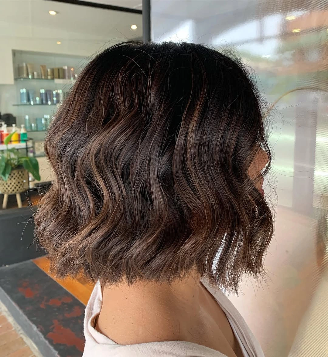 Short wavy dark brown hair with smoky taupe cast
