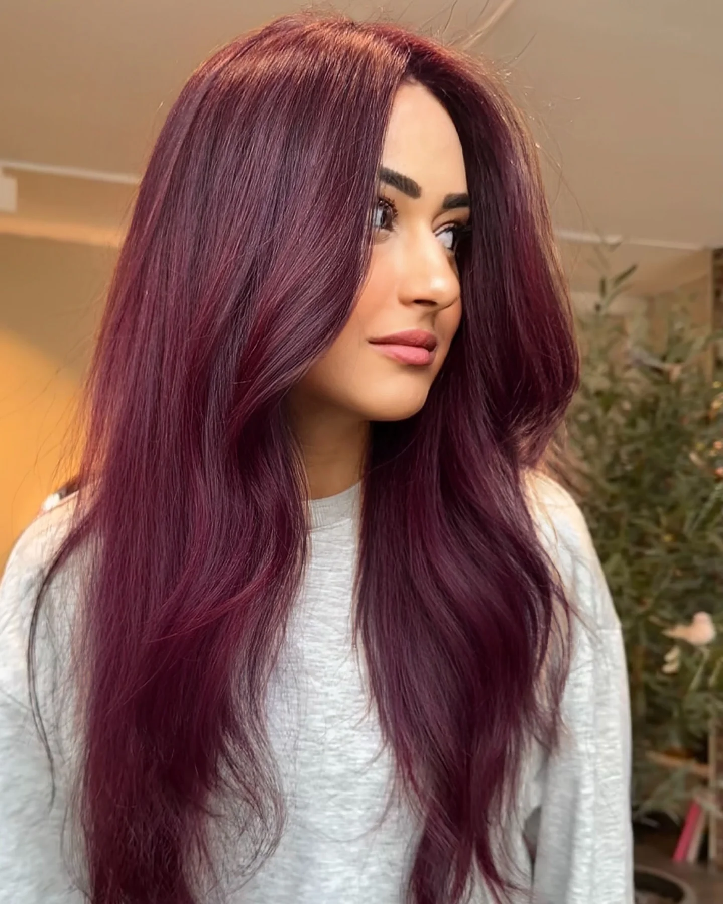 Long smooth burgundy hair with center part
