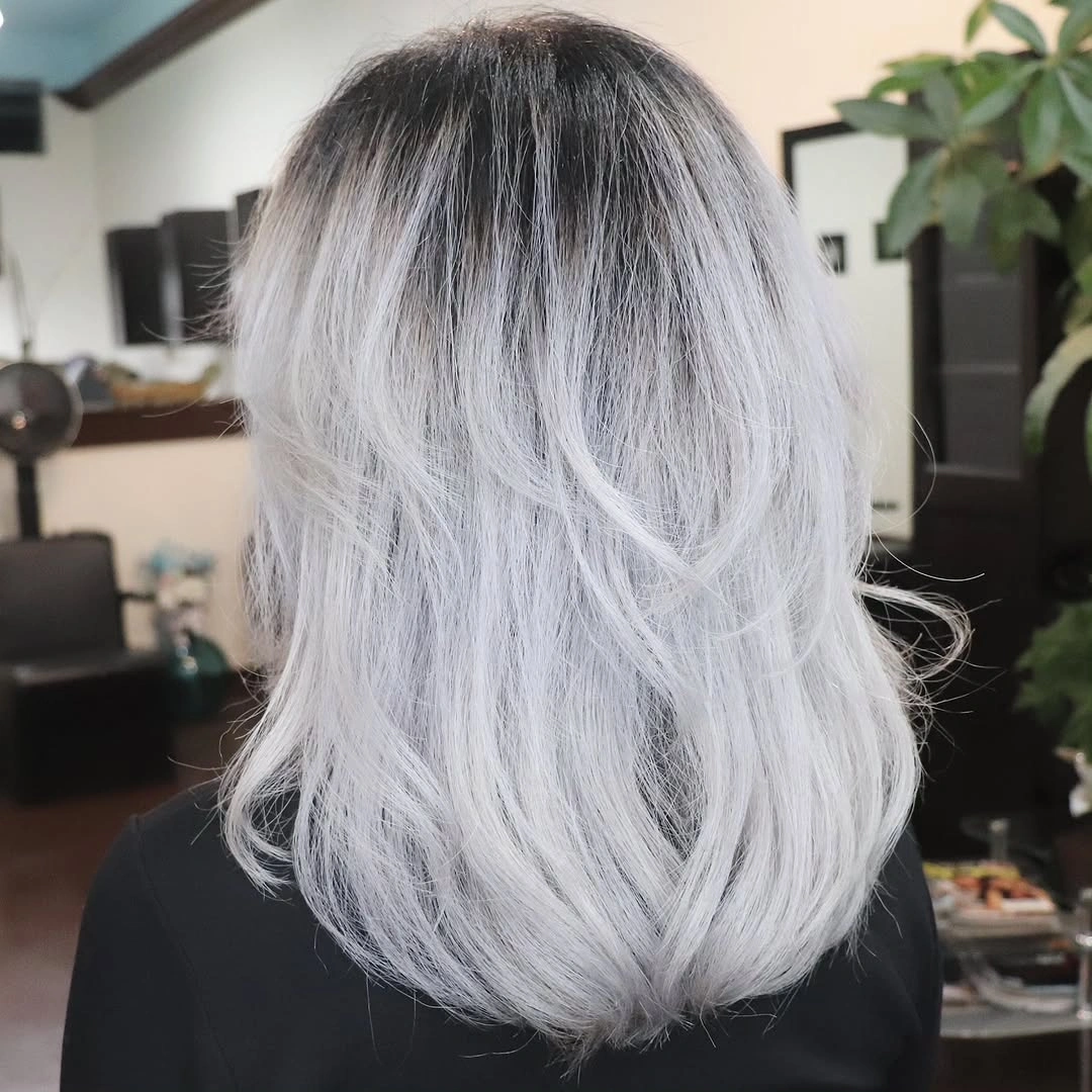 Long pale silver-white waves seen from the back