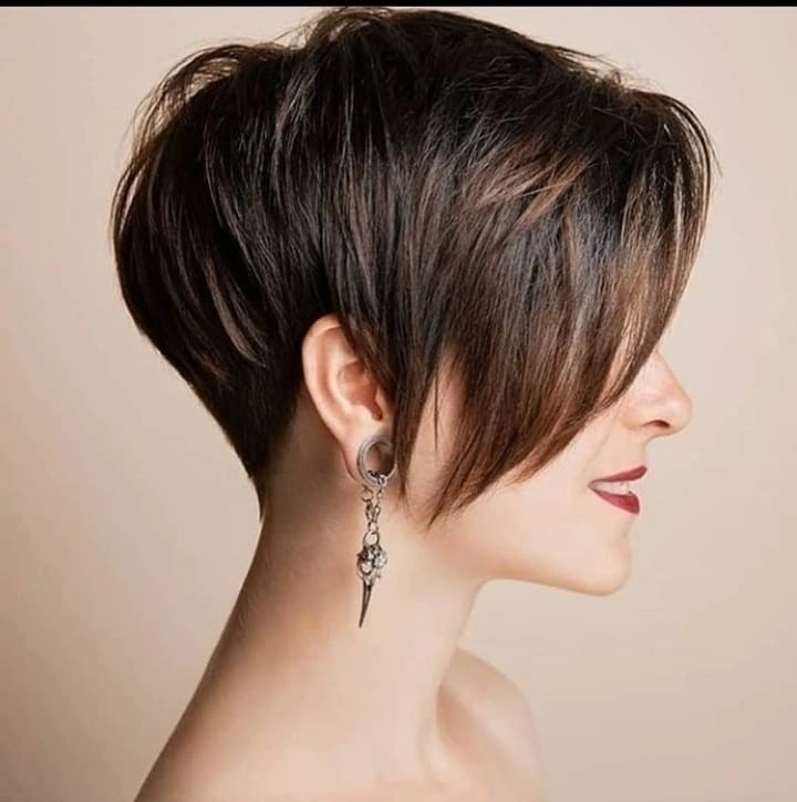 Short dark pixie with close nape and long sweeping front