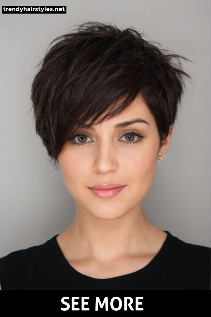 Short dark pixie with textured crown and side-swept fringe
