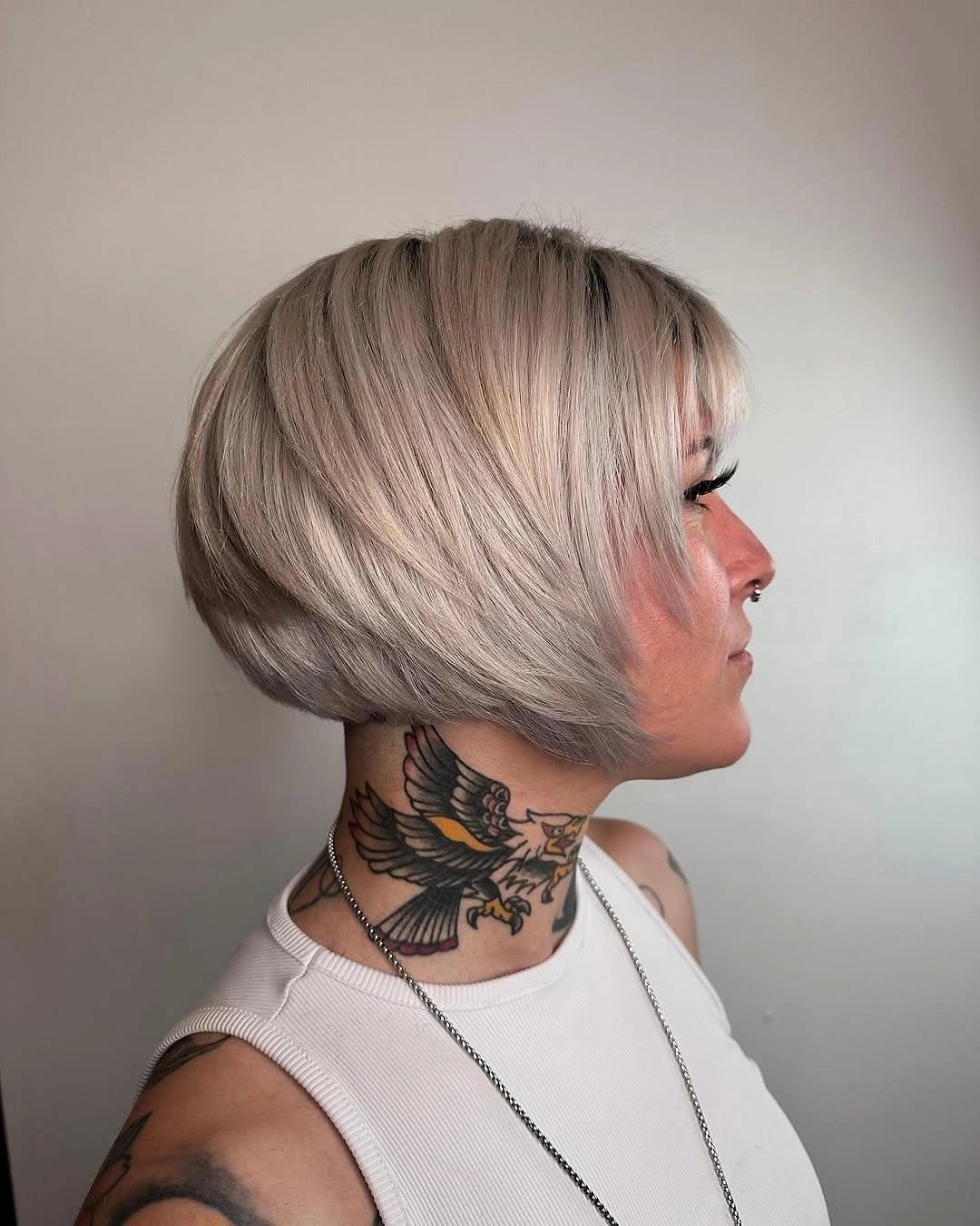 Short silver stacked bob with rounded fuller back