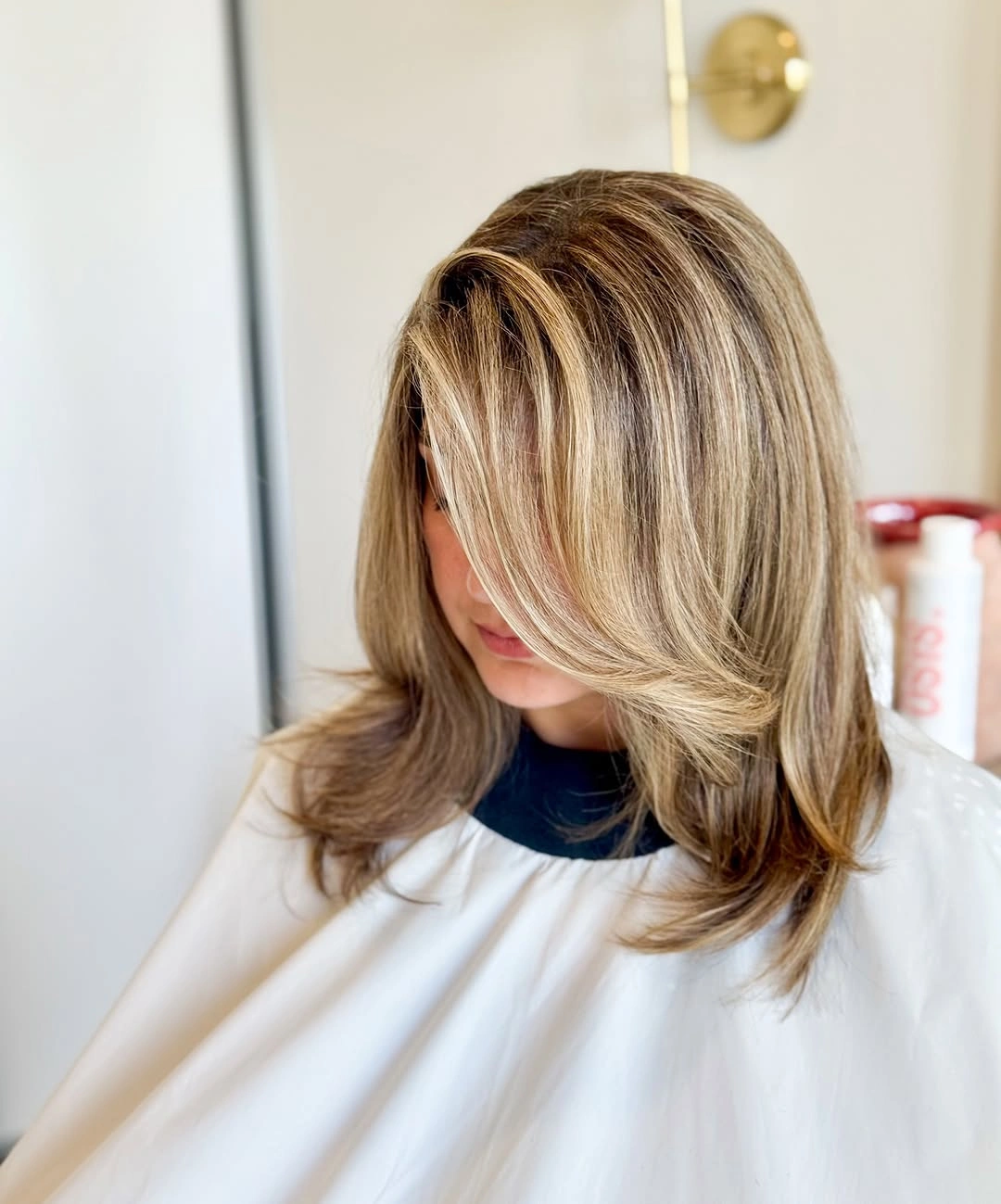 Medium blonde layered cut with sweeping front section