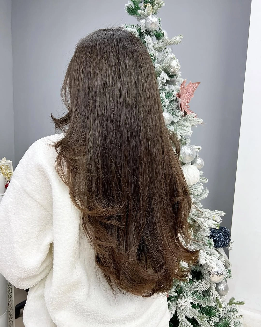 Long dark layered hair viewed from the back