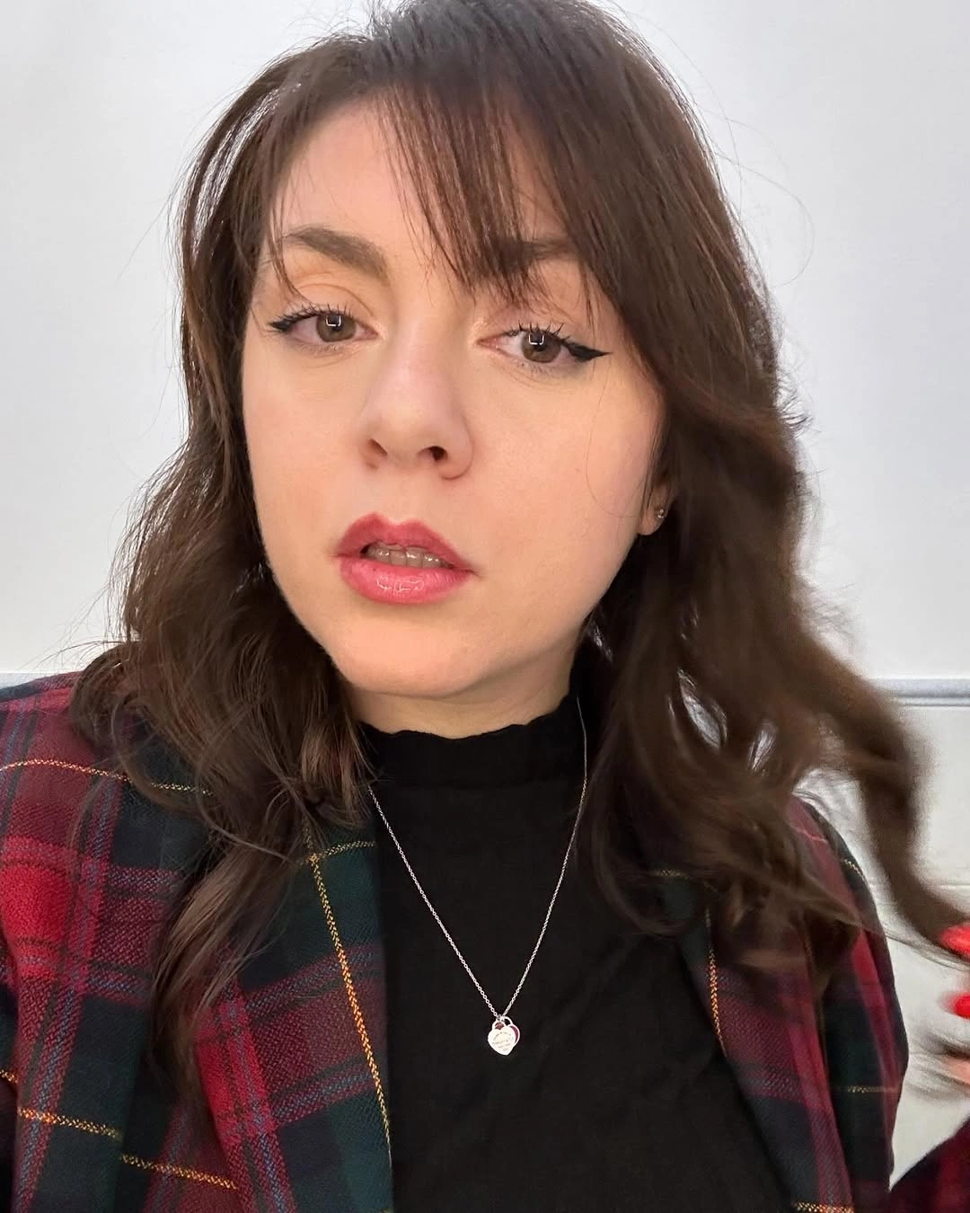 Dark wavy hair with wispy side fringe