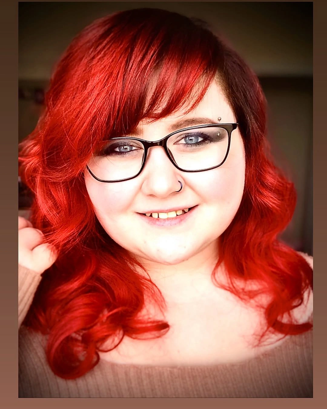 Bright red shoulder-length waves with glasses