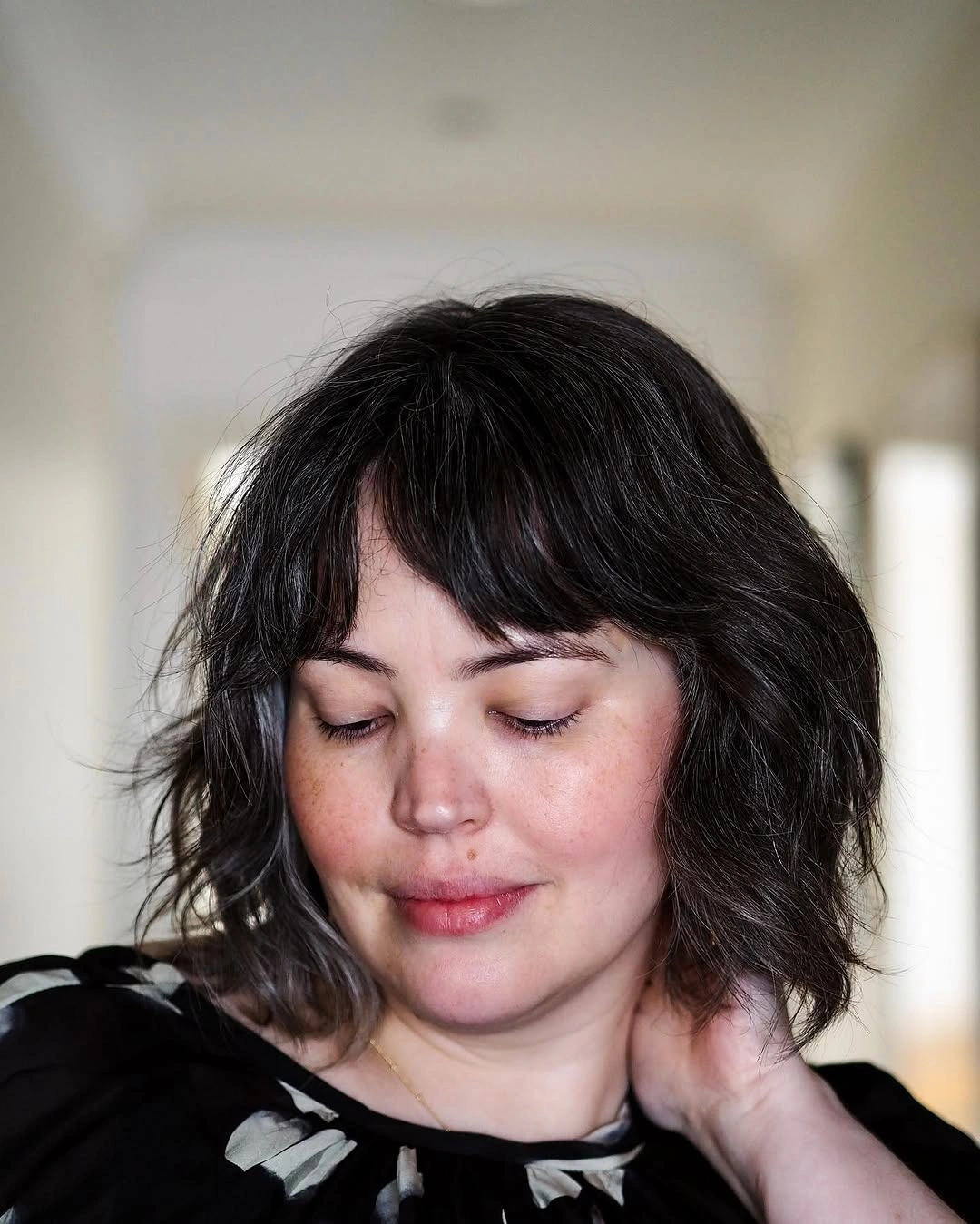 Dark shaggy bob with piecey bangs and waves