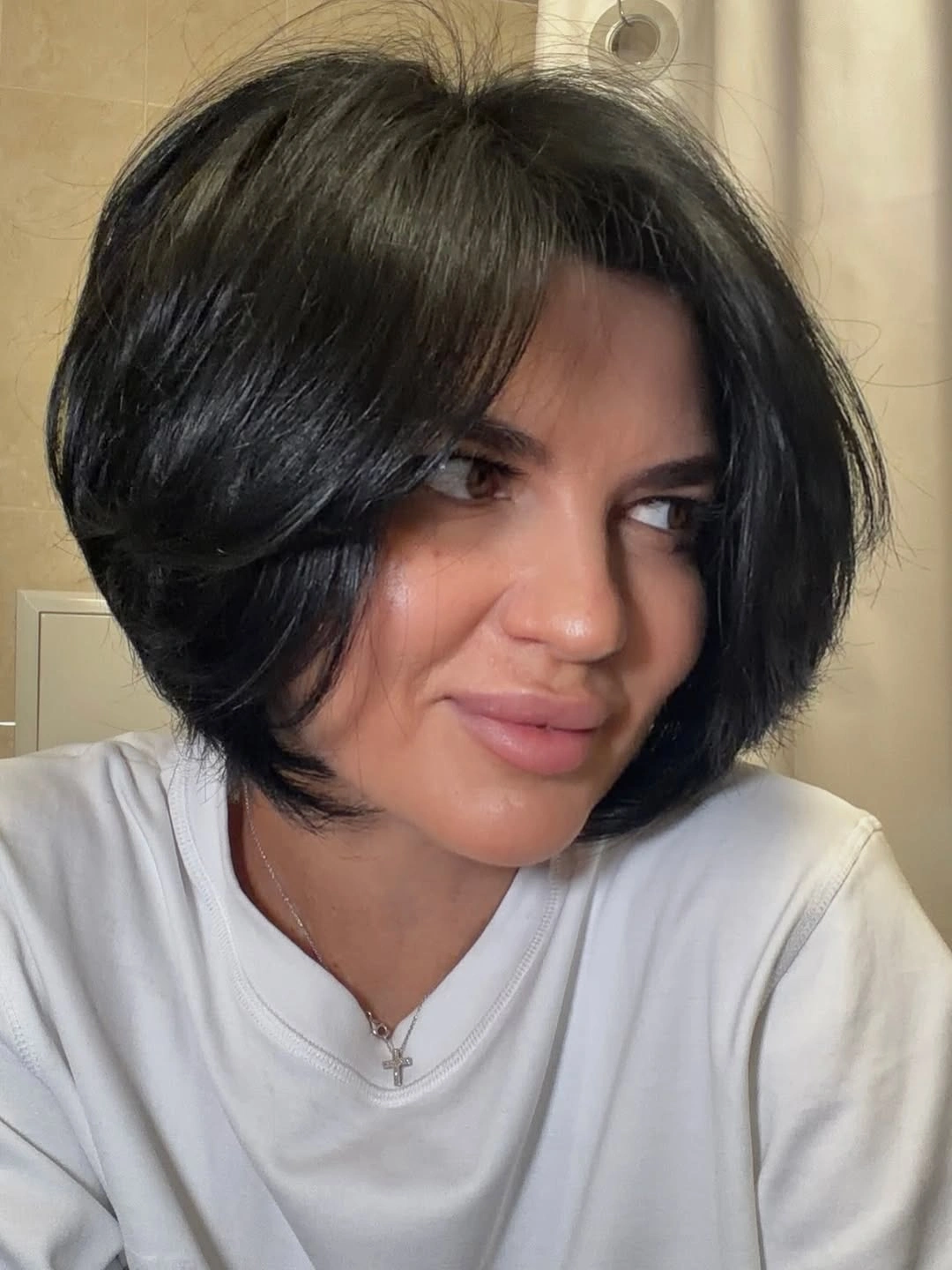 Short dark rounded bob with side-swept front