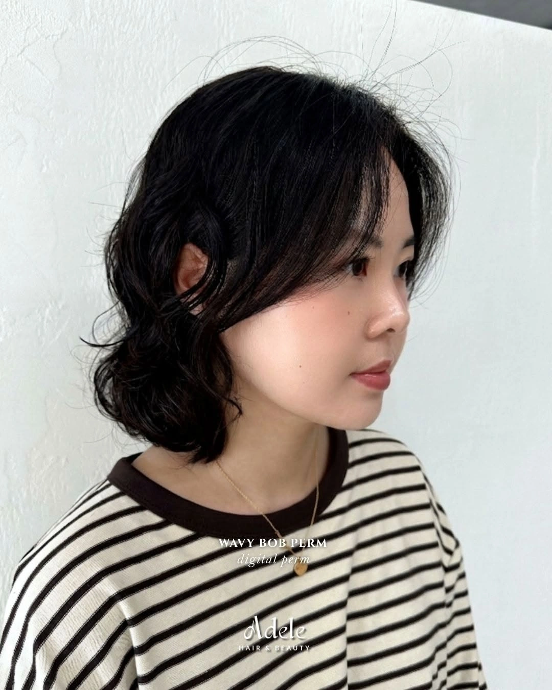 Dark wavy bob with side-swept front pieces