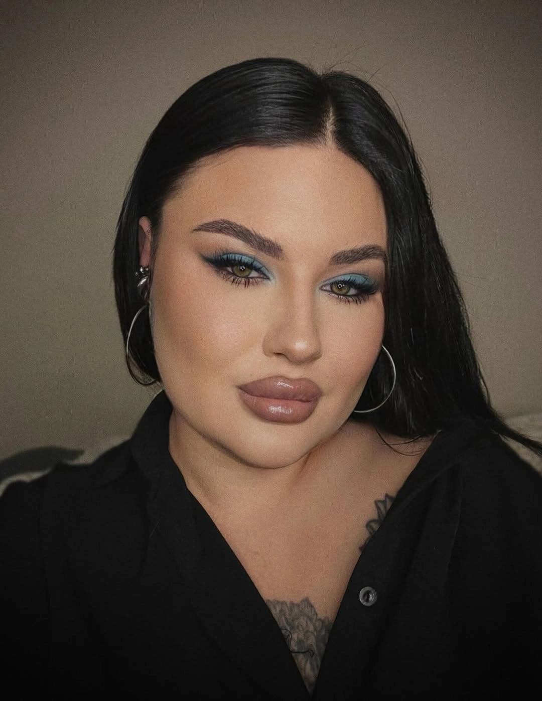 Long sleek black hair with deep side part