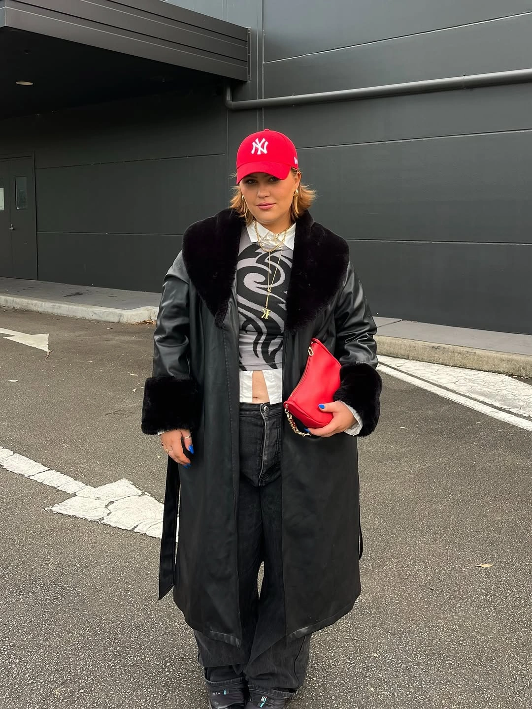 Black coat with red cap and red pouch