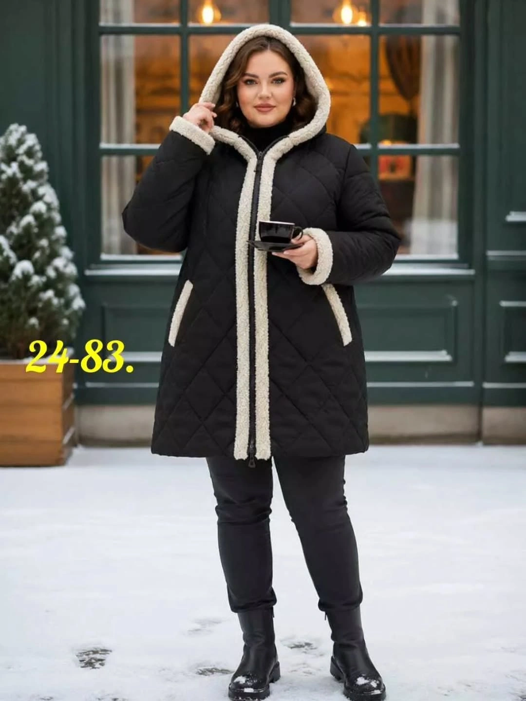 Black hooded quilted coat with light fuzzy-looking trim