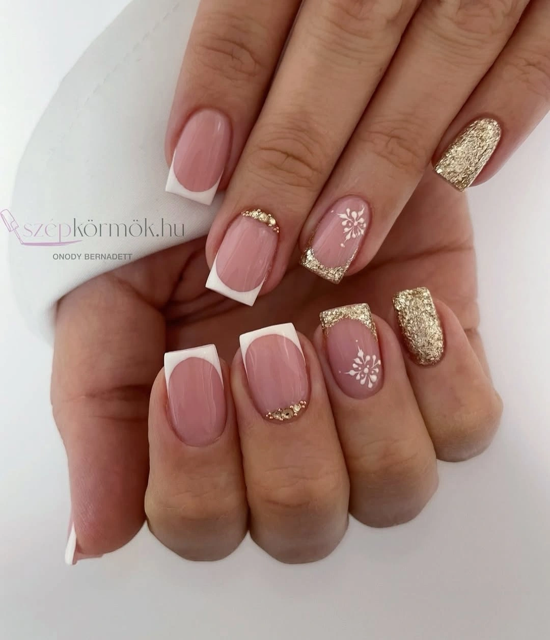 Short square French nails with white tips and gold glitter