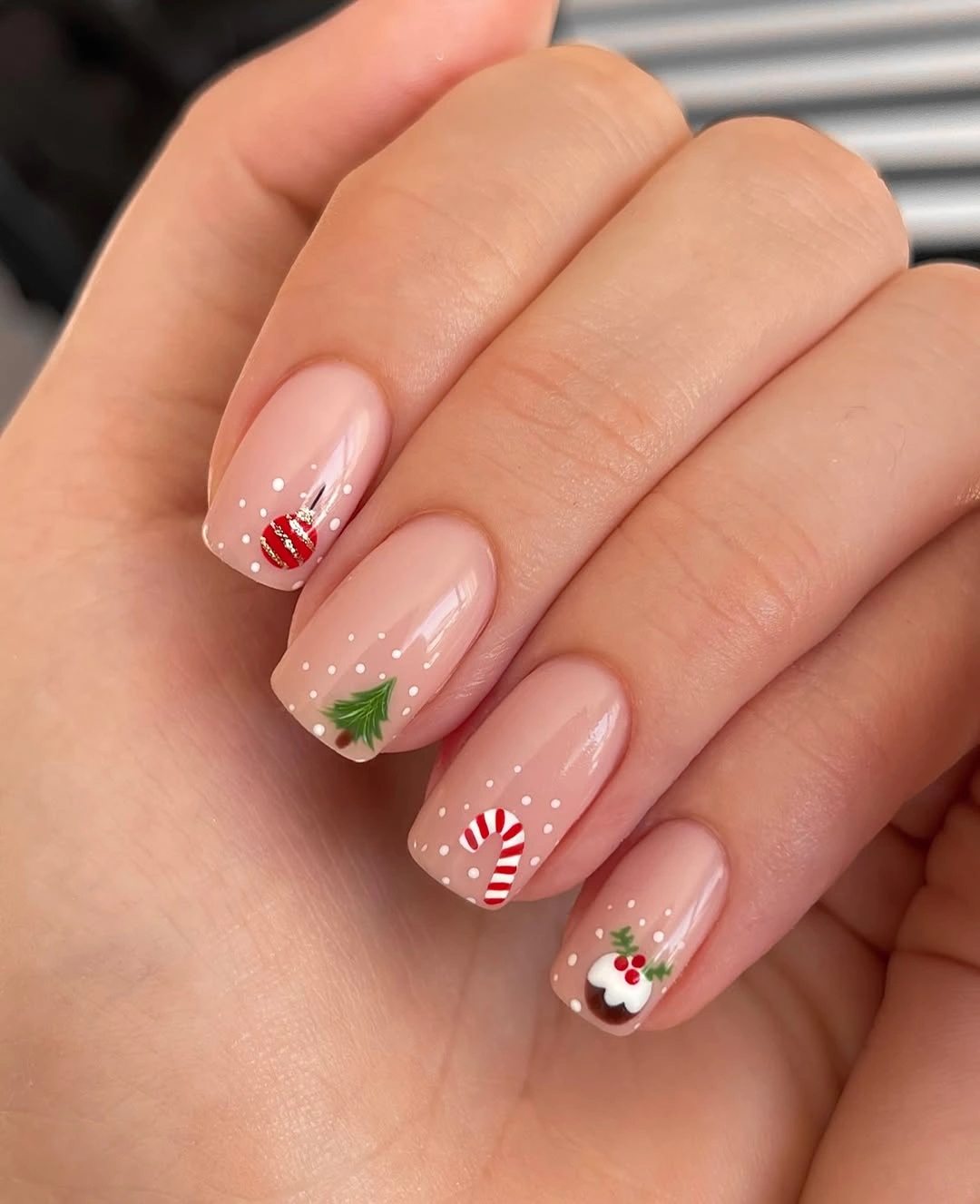 Short sheer pink square nails with candy cane and tree art