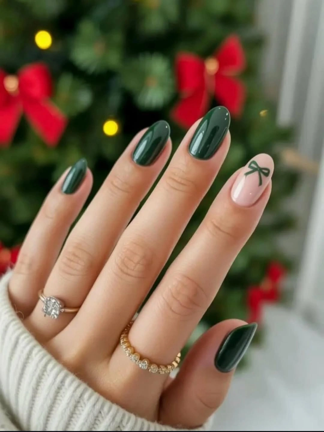 Short green almond nails with one pale bow accent